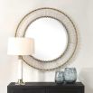 Round mirror with glass panelled framed with brass accents