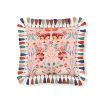 multicoloured cushion with floral pattern and tassels