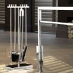 A luxurious set of polished nickel fire place accessories 