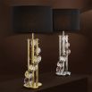 A glamorous table lamp with six crystal orbs, a polished gold finish and a lovely black shade