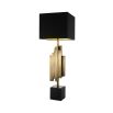 A stylish antique brass and black table lamp