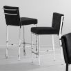 An elegant designer black velvet seat bar stool with stainless steel legs 