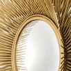 Luxurious mirror inspired by sun rays and finished in a luxurious gold colour
