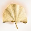 Palm leaf shaped wall lamp in gold