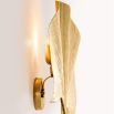 Palm leaf shaped wall lamp in gold