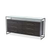 A luxurious six drawer dresser in a charcoal oak finish with a glass surface and metal frame