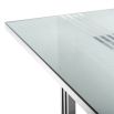 contemporary dining table with transparent surface and stainless steel frame