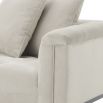 deep-buttoned cream lounge sofa with black legs 