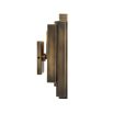 A vintage art deco inspired wall lamp with decorative alternating brass features