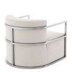 Designer stylish neutral velvet armchair with polished stainless steel frame