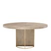 Light brown washed oak circular dining table with brass legs