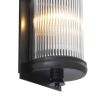 A luxurious matte bronze wall lamp with clear reeded glass 