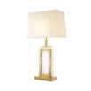 An elegant alabaster and matte brass table lamp with white shade 