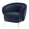 Retro round midnight blue velvet chair with tapered legs