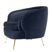 Retro round midnight blue velvet chair with tapered legs