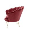 Red art-deco inspired chair with shell design back and gold legs