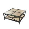 A stylish black mahogany and rattan coffee table