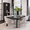 Luxurious Eichholtz neutral toned dining chair with armrests 