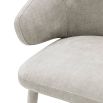 Luxurious Eichholtz neutral toned dining chair with armrests 