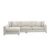 sand coloured L shaped sofa with black legs and four scatter cushions 