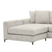 sand coloured L shaped sofa with black legs and four scatter cushions 