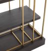 A contemporary industrial-inspired cabinet with polished brass frame and oak shelves