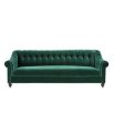 green velvet sofa with buttoning and brass accents 