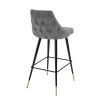 A modern grey velvet bar stool by Eichholtz 