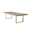 A luxurious rectangular oak wooden dining table with a brushed brass base