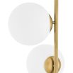 Modern, brass finish floor lamp with 5 glass lampshade detailing and black marble base