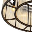 A luxurious bronze chandelier with clear, ribbed glass