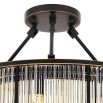 A luxurious bronze chandelier with clear, ribbed glass