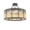 A luxurious bronze chandelier with clear, ribbed glass