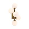 A stylish antique brass wall lamp with white glass shades