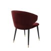 Luxury red velvet dining chair with black and gold tapered legs