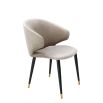 Luxury beige velvet dining chair with black and gold tapered legs