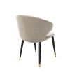 Luxury beige velvet dining chair with black and gold tapered legs