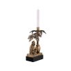 A charming brass candle holder with a decorative monkey and palm tree on a granite base.
