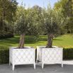 An elegant white, square planter with diamond pattern by Eichholtz 