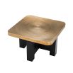 golden ripple-effect coffee table with black base 