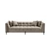 A luxurious sumptuous deep-buttoned sofa with grey velvet upholstery and black legs 