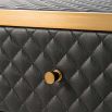 Black, faux leather bedside table with two drawers and diamond quilted upholstery