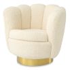 Cocooning shell-shaped swivel chair in faux shearling