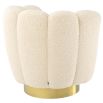 Cocooning shell-shaped swivel chair in faux shearling