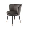 A classy dining chair with a grey velvet upholstery, swivel seat and golden capped feet 