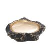 A luxurious rugged bronze bowl with a smooth, polished brass interior