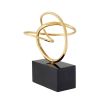 Brass decorative sculpture on black marble base
