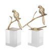 Eichholtz vintage brass decorative bird object on a clear acrylic base set of 2 