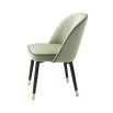 Pistachio green velvet set of 2 dining chairs with faux leather piping an d gold caps on black frame