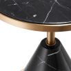 A modern black marble and copper side table with retro undertones